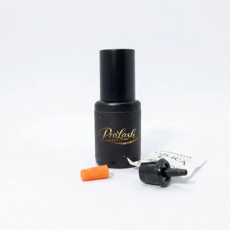 Lash adhesive — Two-tone plastic bottle used for professional beauty products